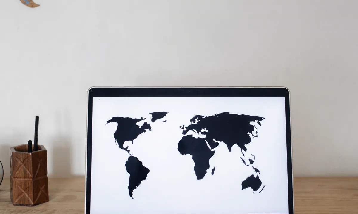 Laptop and map arranged in a workspace for researching local property records